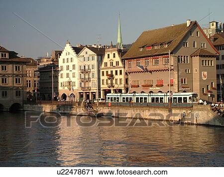 Stock Image -  Switzerland, Europe, Zurich, Zuerich, Limmat River, Limmatquai, trolley, tram. Fotosearch