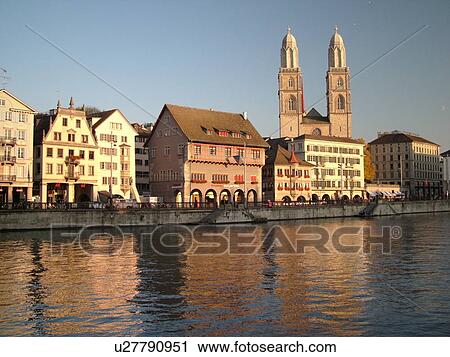 Stock Image -  Switzerland, Europe, Zurich, Zuerich, Limmat River, Grossmunster Cathedral, Limmatquai. Fotosearch