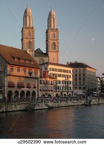Stock Image -  Switzerland, Europe, Zurich, Zuerich, Limmat River, Grossmunster Cathedral, Limmatquai. Fotosearch