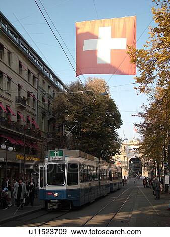 Stock Photo -  Switzerland, Europe, Zurich, Zuerich, downtown, Bahnhofstrasse, trolley, tram, commuters. Fotosearch