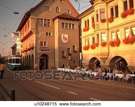 Stock Photography -  Switzerland, Europe, Zurich, Zuerich, Limmatquai, outdoor cafT, trolley, tram. Fotosearch