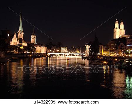 Stock Photography -  Switzerland, Europe, Zurich, Zuerich, Limmat River, Grossmunster Cathedral, Fraumunster Church, evening, moon. Fotosearch
