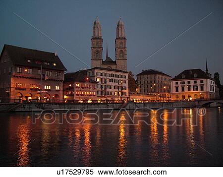 Stock Photography -  Switzerland, Europe, Zurich, Zuerich, Limmat River, Grossmunster Cathedral, Limmatquai, evening. Fotosearch
