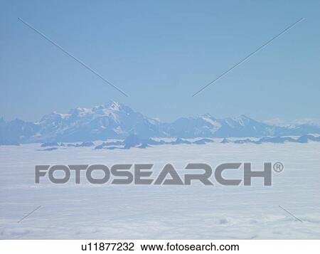 Switzerland, France, Europe, aerial, flying over the Alps, Mt. Blanc, cloud cover, fog View Large Photo Image Stock Image - Switzerland, France, Europe, aerial, flying over the Alps, Mt. Blanc, cloud cover, fog. Fotosearch