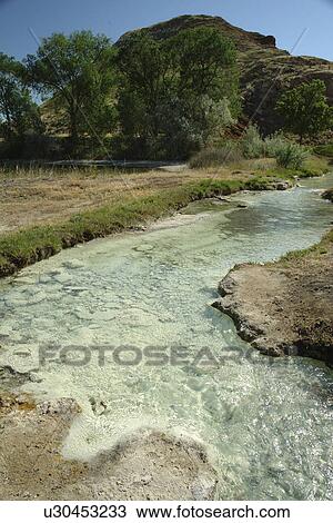 Stock Image -  Thermopolis, WY, Wyoming, Hot Springs State Park, hot springs. Fotosearch