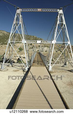 Stock Photo -  Thermopolis, WY, Wyoming, Hot Springs State Park, Big Horn River, Swinging Bridge. Fotosearch