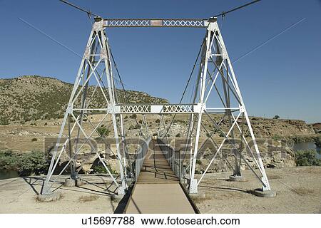 Thermopolis, WY, Wyoming, Hot Springs State Park, Big Horn River, Swinging Bridge View Large Photo Image Stock Photo - Thermopolis, WY, Wyoming, Hot Springs State Park, Big Horn River, Swinging Bridge. Fotosearch