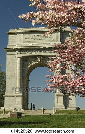 Stock Image -  Valley Forge, PA, Pennsylvania, Valley Forge National Historical Park, National Memorial Arch, Pink Dogwood Trees. Fotosearch