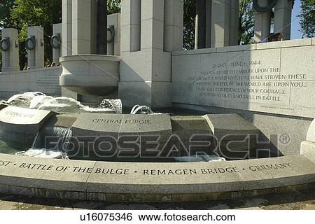 Stock Photograph -  Washington DC, D. C District of Columbia, World War II Memorial, Inscriptions at base of the pavilions mark the key battles fought in WWII, National Mall, Memorial Parks, Nation's Capital, Washington Monument. Fotosearch