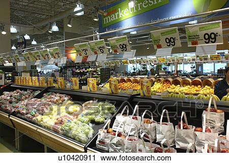 Stock Image -  Waterbury, VT, Vermont, Interior of Shaw's Grocery Store, produce department, apples. Fotosearch