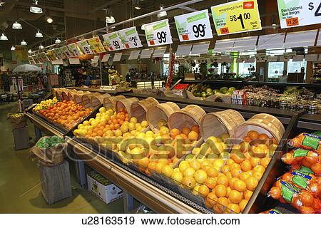 Stock Photo -  Waterbury, VT, Vermont, Interior of Shaw's Grocery Store, produce department, oranges. Fotosearch
