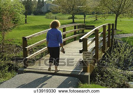 West Chester, PA, Pennsylvania, Hershey's Mill Chester County, woman walking across a bridge, recreation path View Large Photo Image Stock Image - West Chester, PA, Pennsylvania, Hershey's Mill Chester County, woman walking across a bridge, recreation path. Fotosearch