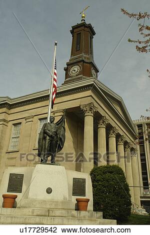 Stock Image -  West Chester, PA, Pennsylvania, Chester County, Chester County Courthouse ca. 1724, Old Glory Statue, American Flag, downtown. Fotosearch