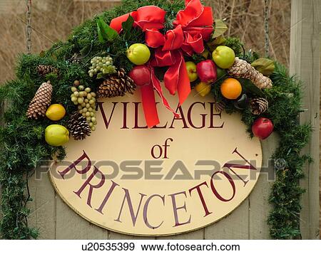 Stock Photo -  West Chester, PA, Pennsylvania, Hershey's Mill Chester County, Christmas decorations, Village of Princeton, entrance sign decorated for the Christmas holidays. Fotosearch