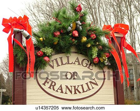 Stock Photography -  West Chester, PA, Pennsylvania, Hershey's Mill Chester County, Christmas decorations, Village of Franklin entrance sign decorated for the Christmas holidays. Fotosearch
