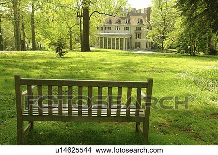 Picture -  Wilmington, DE, Delaware, Brandywine River Valley, Winterthur, an American Country Estate, Museum and County Estates, former home of Henry Francis du Pont, natural garden, park bench. Fotosearch