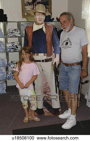 Winterset, Madison County, IA, Iowa, John Wayne Birthplace, store, visitor center, father and daughter posing with cardboard John Wayne View Large Photo Image Stock Image - Winterset, Madison County, IA, Iowa, John Wayne Birthplace, store, visitor center, father and daughter posing with cardboard John Wayne . Fotosearch