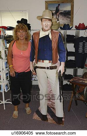 Winterset, Madison County, IA, Iowa, John Wayne Birthplace, store, visitor center, woman posing with cardboard John Wayne View Large Photo Image Stock Photography - Winterset, Madison County, IA, Iowa, John Wayne Birthplace, store, visitor center, woman posing with cardboard John Wayne . Fotosearch