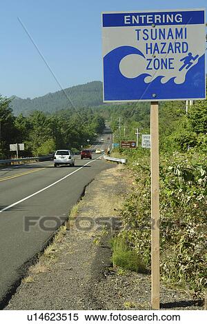 Stock Photography -  Arch Cape, OR, Oregon, Pacific Ocean, Pacific Coast Scenic Byway, Rt Route, Highway 101, Tsunami Hazard Zone, warning sign. Fotosearch
