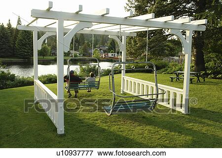 Bend, OR, Oregon, downtown, public park, swings made from chair lifts View Large Photo Image Stock Photo - Bend, OR, Oregon, downtown, public park, swings made from chair lifts. Fotosearch