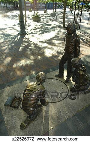 Stock Image -  Boise, ID, Idaho, downtown, plaza, statue of children playing marbles. Fotosearch
