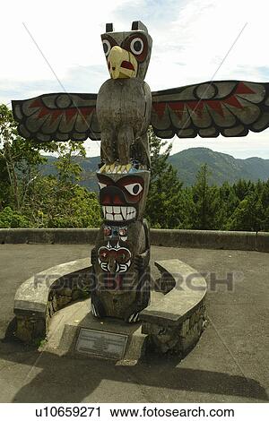 Stock Image -  British Columbia, Canada, Vancouver Island, Totem pole along Trans Canada Highway. Fotosearch