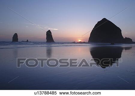 Cannon Beach, OR, Oregon, Pacific Ocean, Pacific Coast Scenic Byway, Rt Route, Highway 101, Cannon Beach, Haystack Rock, reflection, sunset View Large Photo Image Stock Photography - Cannon Beach, OR, Oregon, Pacific Ocean, Pacific Coast Scenic Byway, Rt Route, Highway 101, Cannon Beach, Haystack Rock, reflection, sunset. Fotosearch