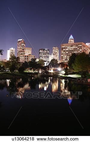 Stock Photo -  Charlotte, NC, North Carolina, Downtown Skyline, Marshall Park, evening. Fotosearch