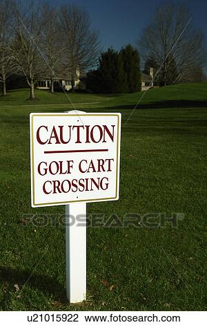 Stock Image -  Chester County, PA, Pennsylvania, Golf Cart Crossing sign, Golf course. Fotosearch
