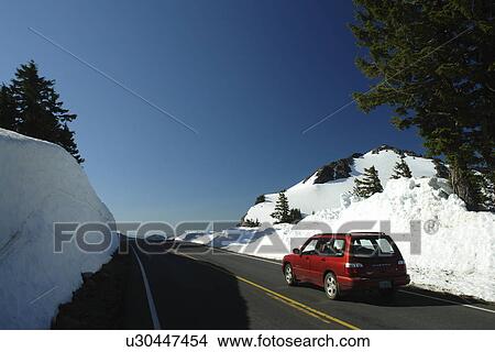 Crater Lake National Park, OR, Oregon, Cascade Range, Volcanic Legacy Scenic Byway, Rim Drive, side of road packed high with snow View Large Photo Image Picture - Crater Lake National Park, OR, Oregon, Cascade Range, Volcanic Legacy Scenic Byway, Rim Drive, side of road packed high with snow. Fotosearch