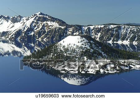 Stock Image -  Crater Lake National Park, OR, Oregon, Cascade Range, Volcanic Legacy Scenic Byway from Rim Drive, Wizard Island. Fotosearch