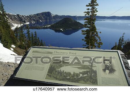 Stock Photo -  Crater Lake National Park, OR, Oregon, Cascade Range, Volcanic Legacy Scenic Byway, Rim Drive, Wizard Island, overlook, interpretive sign. Fotosearch