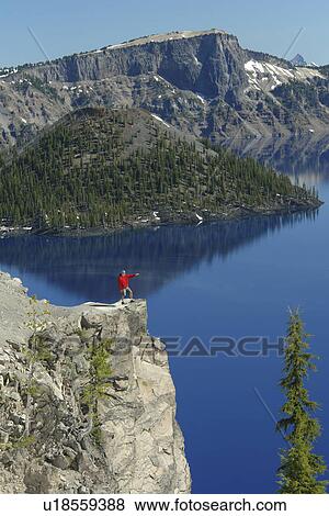 Stock Photo -  Crater Lake National Park, OR, Oregon, Cascade Range, Volcanic Legacy Scenic Byway, Rim Drive, Wizard Island. Fotosearch