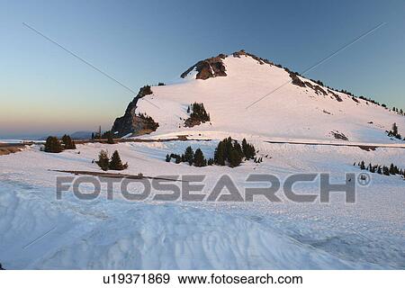 Crater Lake National Park, OR, Oregon, Cascade Range, Volcanic Legacy Scenic Byway from Rim Drive, snow, sunset View Large Photo Image Stock Photo - Crater Lake National Park, OR, Oregon, Cascade Range, Volcanic Legacy Scenic Byway from Rim Drive, snow, sunset. Fotosearch