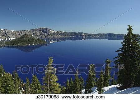 Stock Photo -  Crater Lake National Park, OR, Oregon, Cascade Range, Volcanic Legacy Scenic Byway, Rim Drive, Wizard Island. Fotosearch