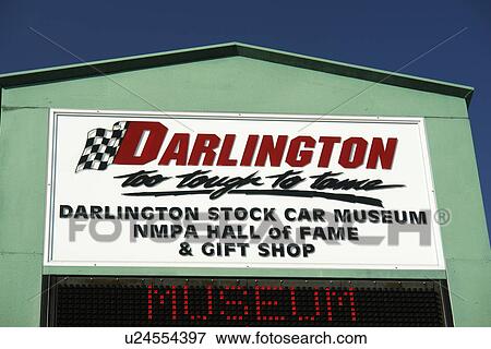 Stock Photo -  Darlington, SC, South Carolina, Darlington Speedway, Stock Car Museum, NMPA Hall of Fame & Gift shop entrance sign. Fotosearch