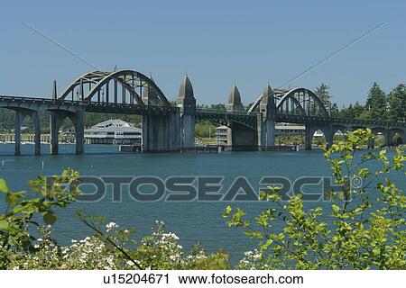 Stock Image -  Florence, OR, Oregon, Pacific Ocean, Pacific Coast Scenic Byway, Rt Route, Highway 101, Old Town Florence, Siuslaw Bay, River Bridge. Fotosearch