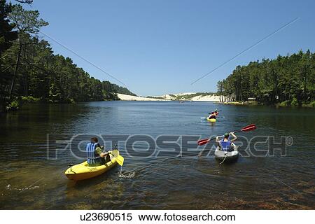 Stock Photography -  Florence, OR, Oregon, Pacific Ocean, Pacific Coast Scenic Byway, Rt Route, Highway 101, Oregon Dunes National Recreation Area, Siuslaw National Forest, Jessie M. Honeyman Memorial State Park, fresh water lake, kayaking. Fotosearch