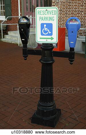 Stock Image -  Gettysburg, PA, Pennsylvania, downtown, parking meters, Reserved Parking for Handicapped. Fotosearch