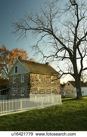 Stock Photo -  Gettysburg, PA, Pennsylvania, Gettysburg National Military Park, stone house with white picket fence. Fotosearch