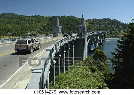 Stock Photo -  Gold Beach, OR, Oregon, Pacific Ocean, Pacific Coast Scenic Byway, Rt Route, Highway 101, Rogue River, I. L. Patterson Memorial Bridge. Fotosearch