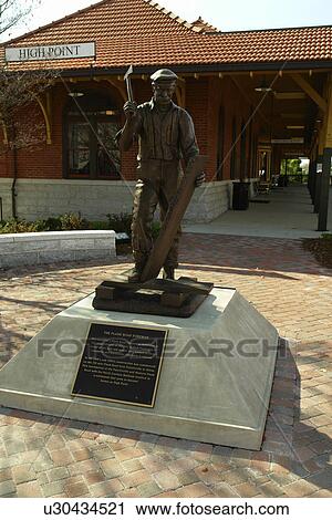 Stock Image -  High Point, NC, North Carolina, The Plank Road Foreman Statue, train station. Fotosearch