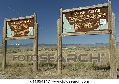 Stock Photo -  ID, Idaho, near Silver City, Ghost Town, War Eagle Mines, Diamond Gulch, historical markers, wooden road signs, mining. Fotosearch