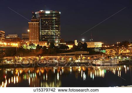 Stock Image -  Knoxville, TN, Tennessee, Downtown Skyline, evening, Tennessee River. Fotosearch