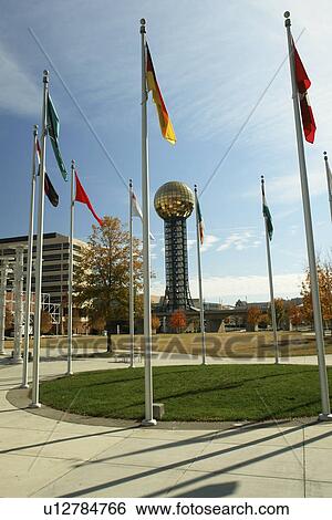 Stock Photograph -  Knoxville, TN, Tennessee, Downtown, Worlds Fair Park, 1982 World's Fair Sunsphere, flags, autumn. Fotosearch