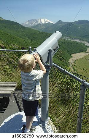 Mount St. Helens National Volcanic Monument, WA, Washington, Forest Learning Center at Mt. Saint Helens, overlook, young boy looking through a telescope View Large Photo Image Stock Image - Mount St. Helens National Volcanic Monument, WA, Washington, Forest Learning Center at Mt. Saint Helens, overlook, young boy looking through a telescope. Fotosearch