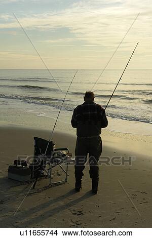 Myrtle Beach, SC, South Carolina, The Grand Strand, man fishing View Large Photo Image Picture - Myrtle Beach, SC, South Carolina, The Grand Strand, man fishing. Fotosearch