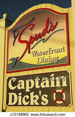 Stock Image -  Myrtle Beach, SC, South Carolina, The Grand Strand, Murrells Inlet, Captain Dick's Waterfront Dining, restaurant sign. Fotosearch