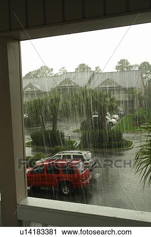 Stock Image -  Myrtle Beach, SC, South Carolina, The Grand Strand, Plantation Resort, rain shower, parking lot. Fotosearch
