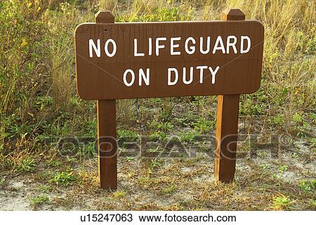 Stock Image -  Myrtle Beach, SC, South Carolina, The Grand Strand, No Lifeguard on Duty sign, beach, water safety. Fotosearch
